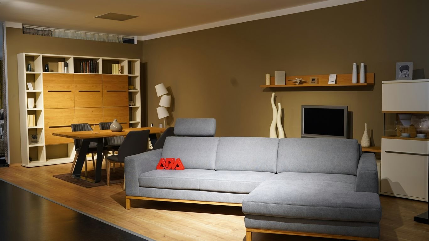 a living room filled with furniture and a flat screen tv