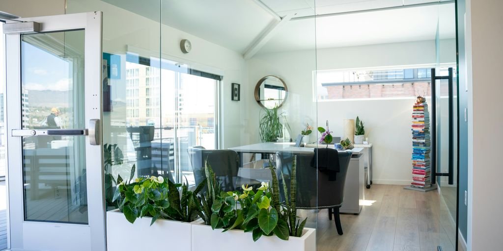 A bright and modern office space with glass walls.
