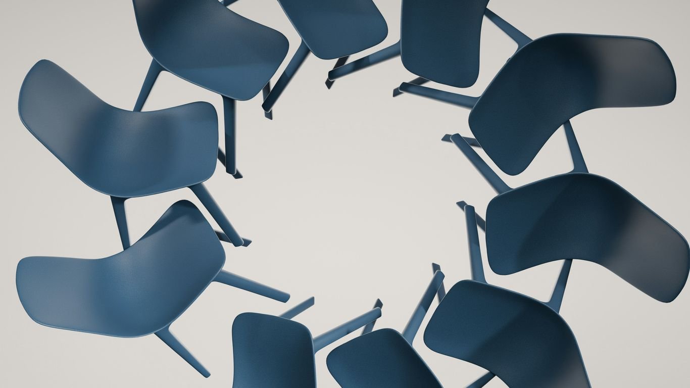 Chairs are arranged in a circular shape.